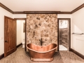 Copper Soaking Tub Framed With Stone